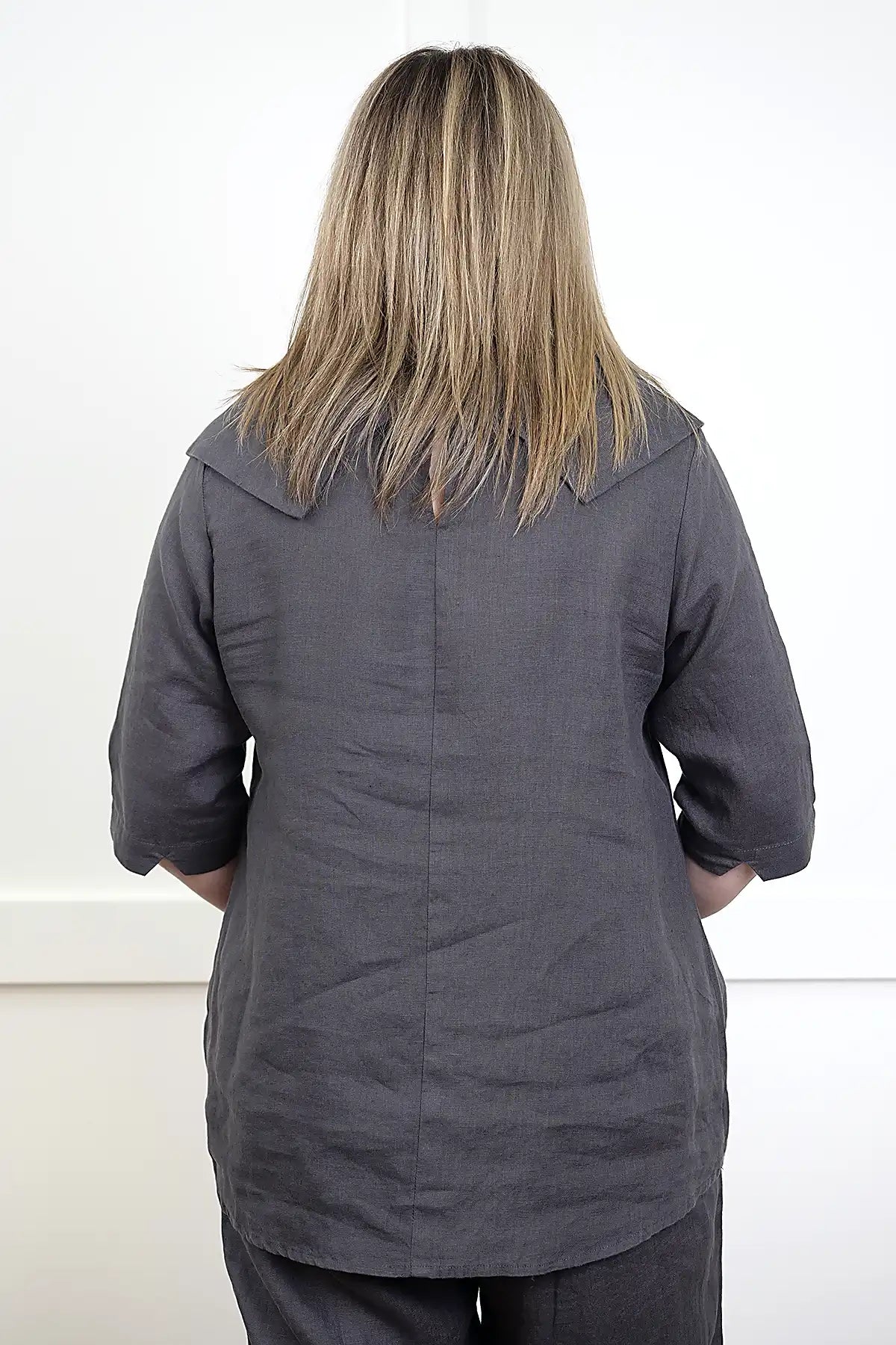 Person wearing a See Saw Linen Cowl Neck Top in Charcoal from behind on a white background