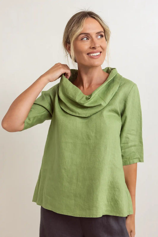 Woman wearing a See Saw Linen Cowl Neck Top in Pistachio against a plain background