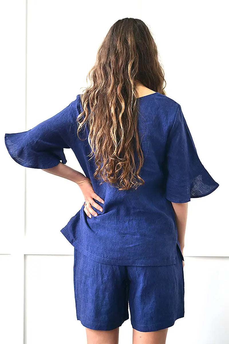 back view of the See Saw Linen Flutter Sleeve Top in Navy