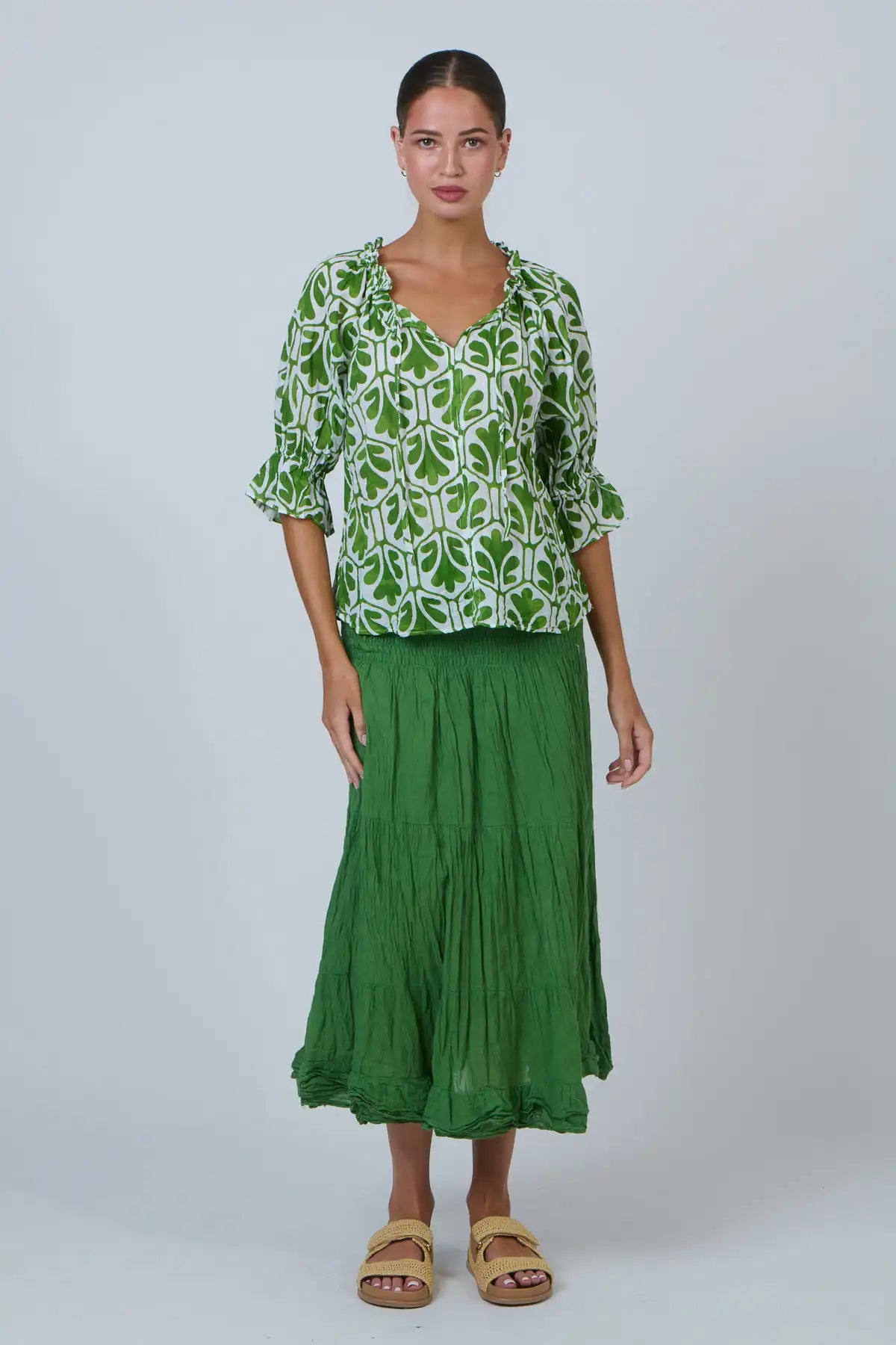 woman wearing the Summer Garden Crinkle Cotton Top and green skirt & sandals full comes view