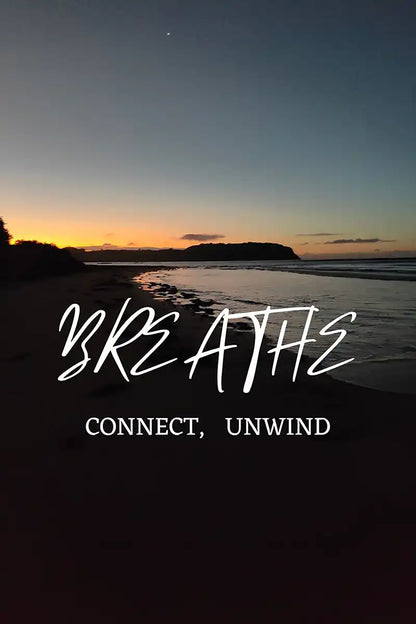 Ocean image with the words breathe, connect unwind on it