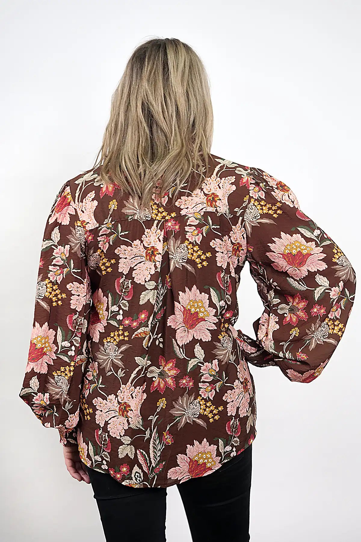 Person wearing a Wildflower Lace Blouse in Chocolate with a white background rear view of top.