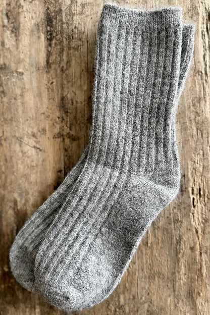 Gray sock on a wooden surface