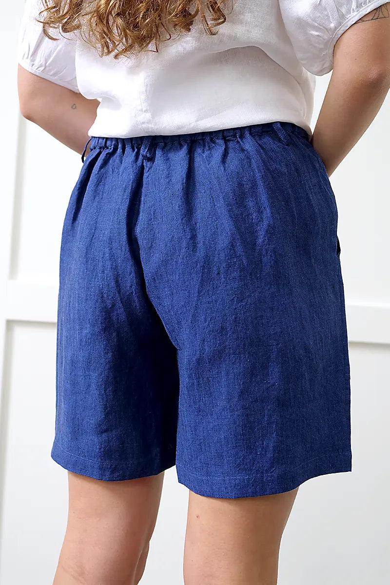 back view of the See Saw Linen Midi Short in Navy