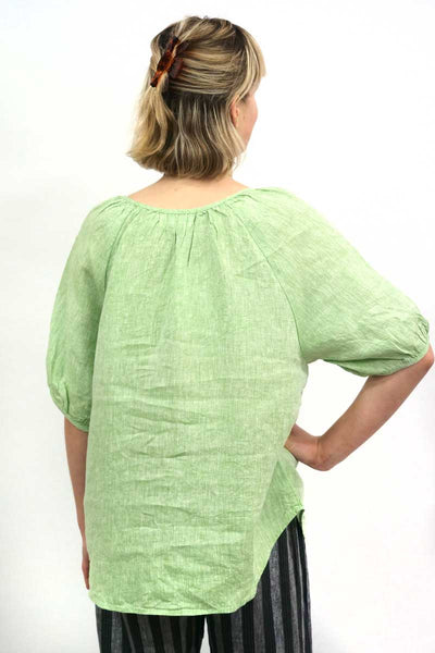 back view of the Naturals by O & J Linen Top in Poire Button