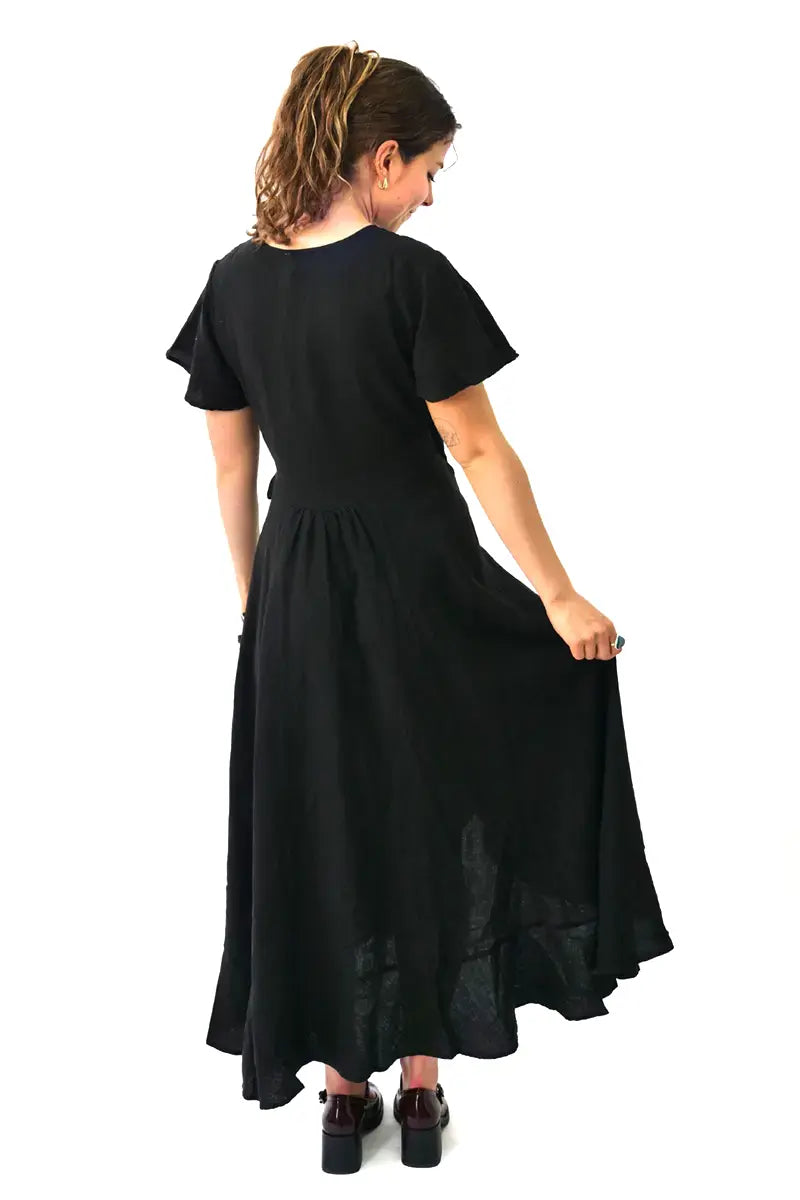 back view of the Humidity  Kai Linen Wrap Dress in Black