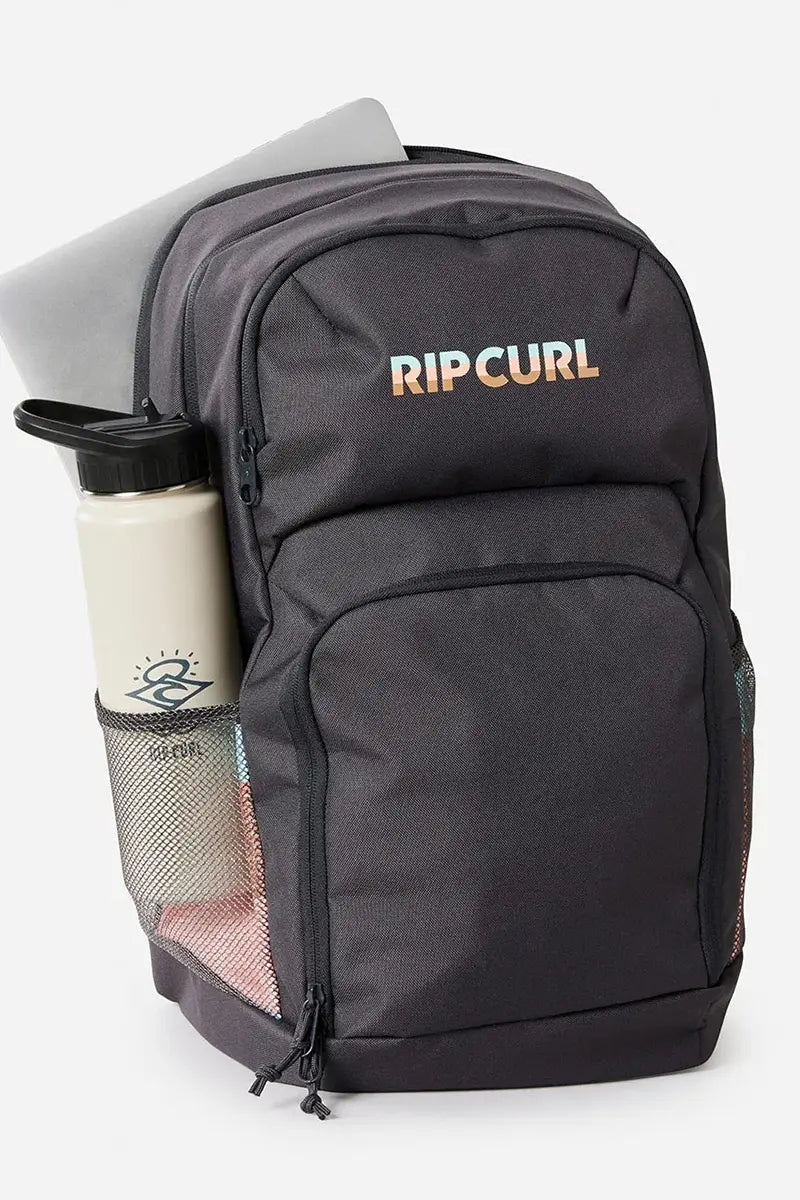 showing laptop pocket and drink bottle compartment for the Rip Curl Backpack Chaser 33L in Back Multi