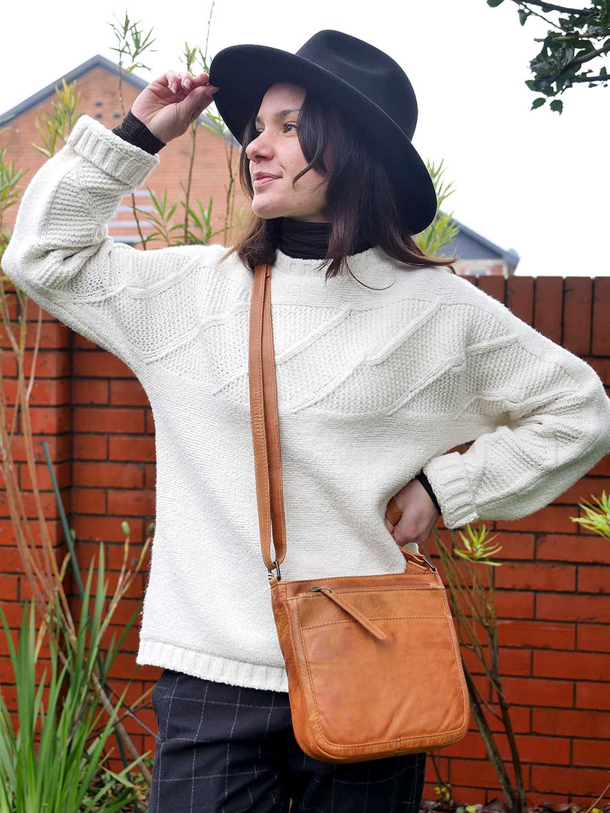 model wearing Rugged Hide Ladies Cross Body Bag - Pam in Tan