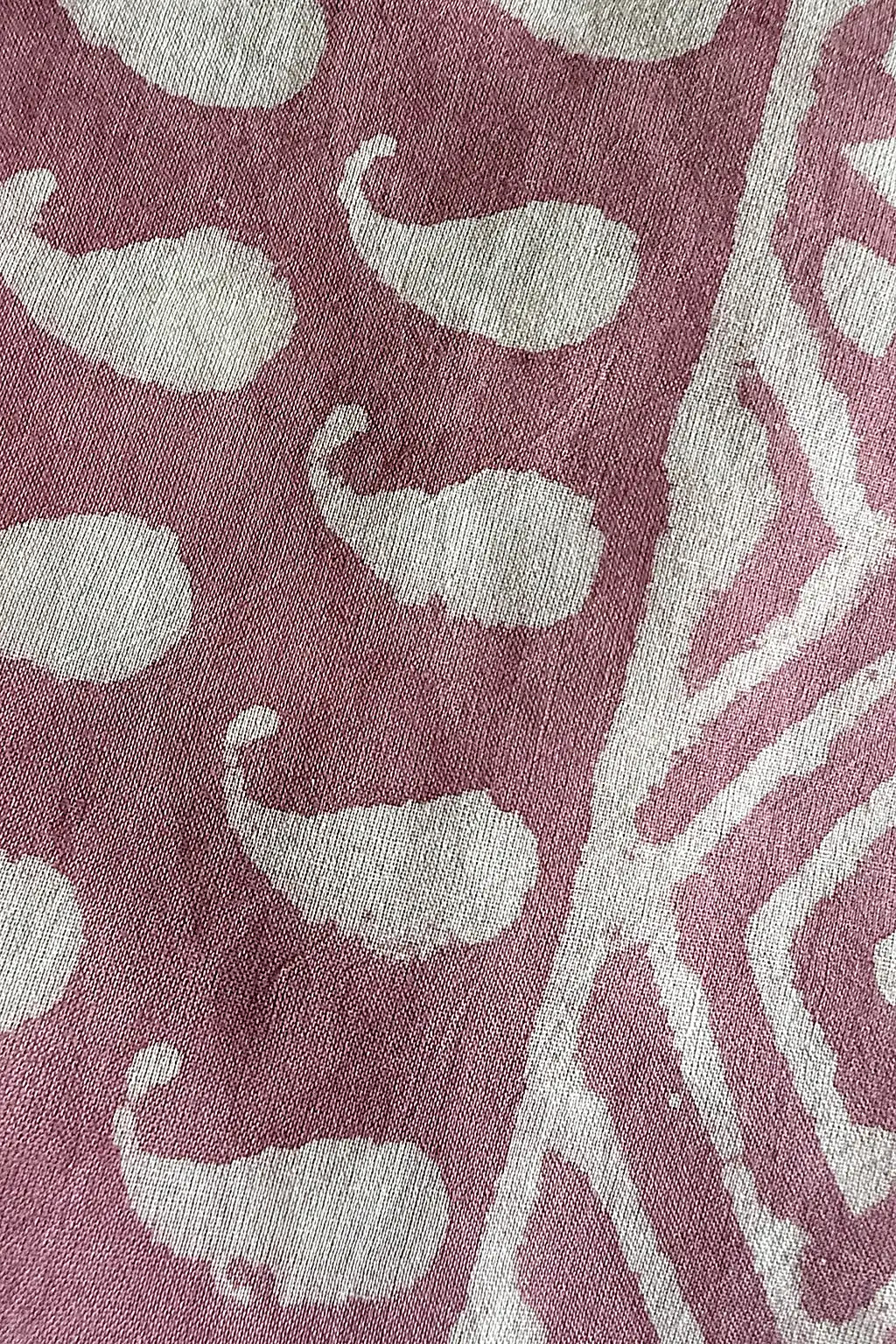 organic cottong scarf with white pattern on a pink background