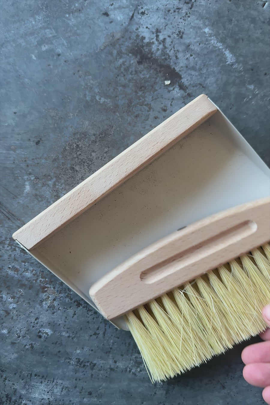 video of dustpan and brush connecting with magnet