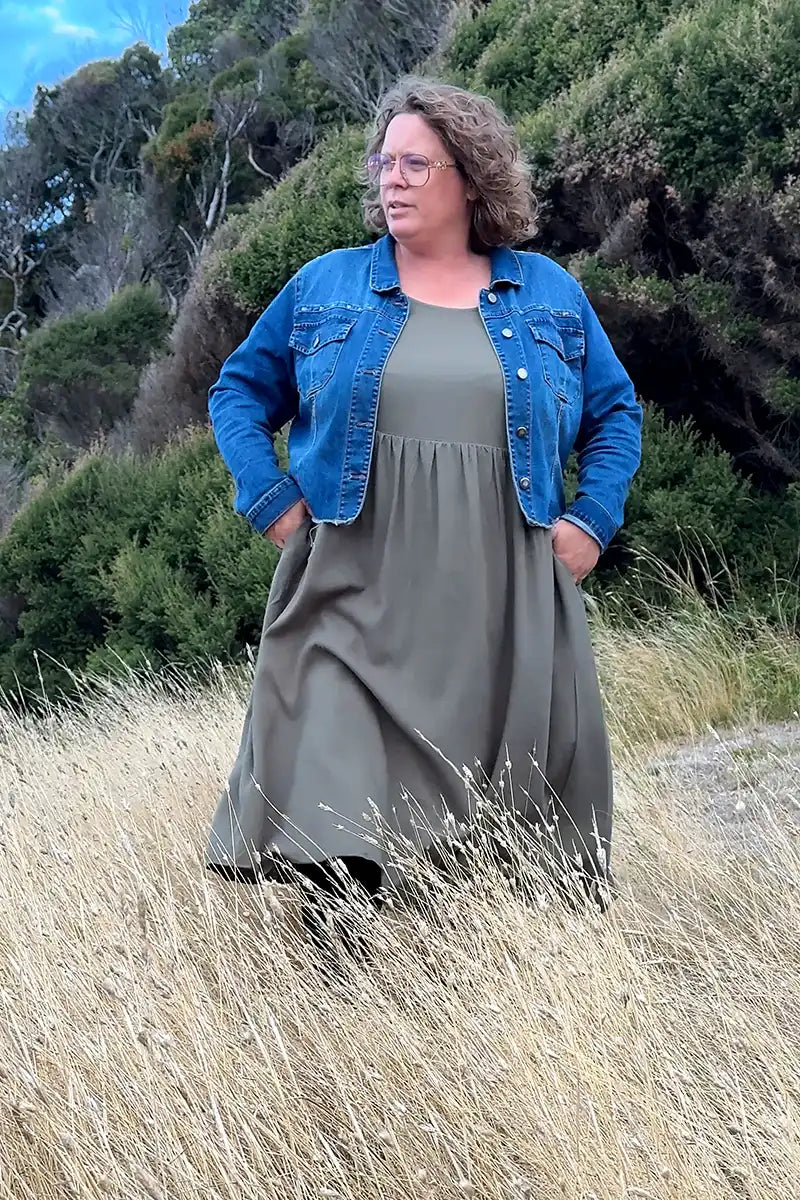 walking through the long grass in the wild at heart dress