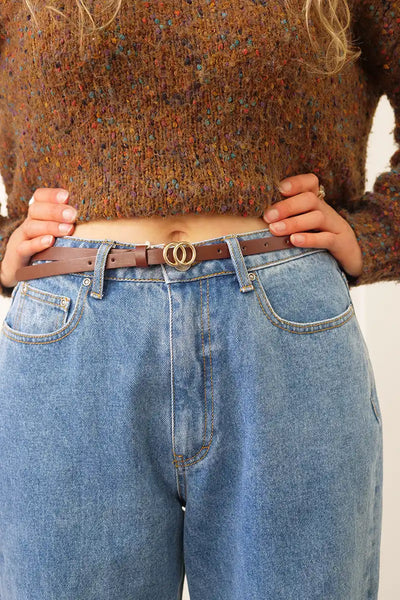 Chille Womens Skinny Belt in Rust on a pair of jeans