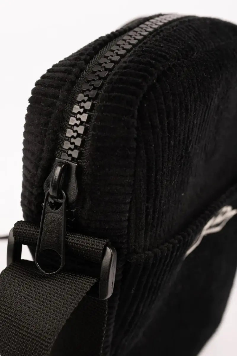 zip detail on the Rusty Decade Cord Side Bag in Black