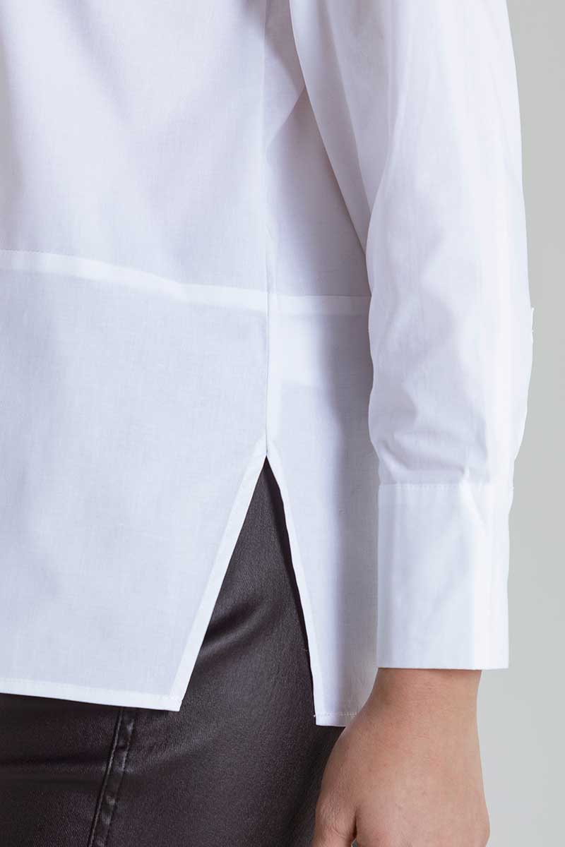 Cuff and hem detail view of the Marco Polo Women's Button Shirt in white